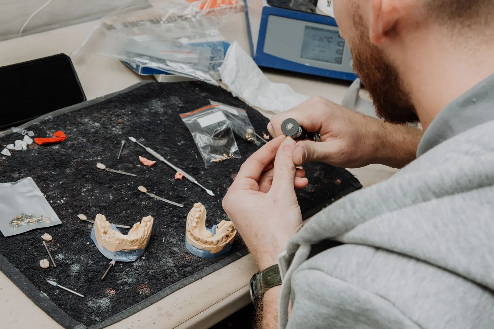 Dental technician working at the bench