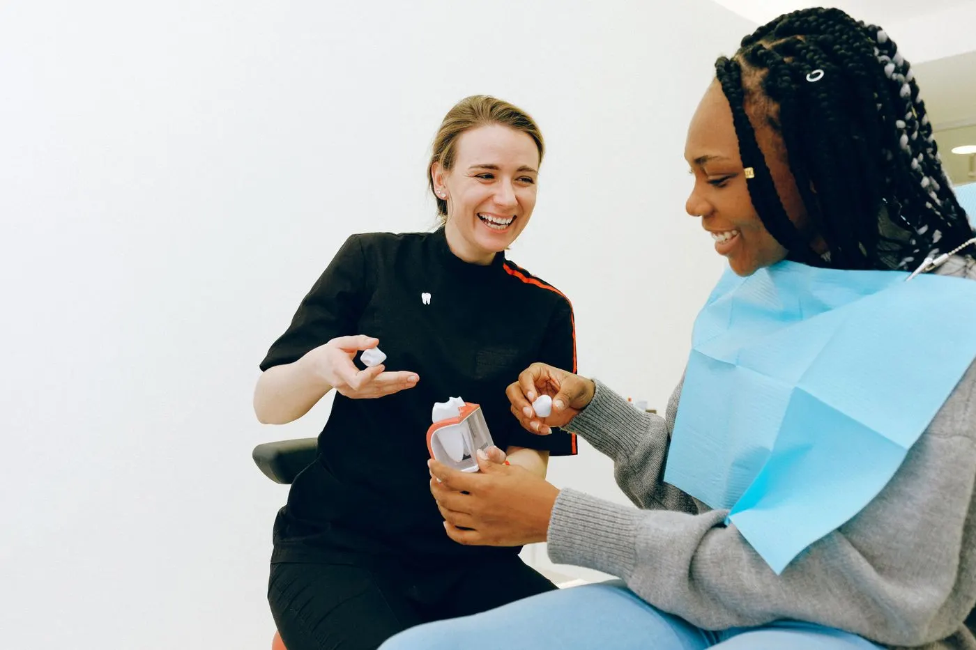 Dental consultation with a tooth model